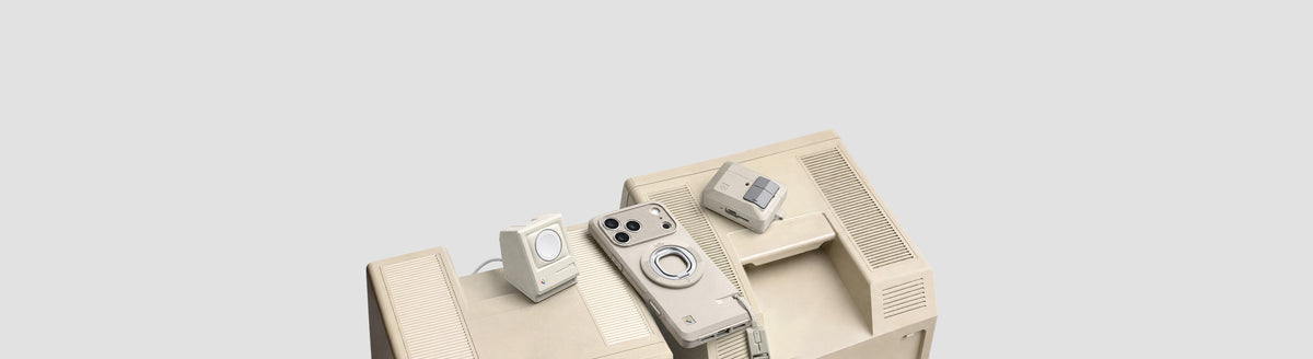 Spigen iPhone case, AirPods case, and charging accessory in retro beige, arranged on top of a vintage Macintosh computer for a matching aesthetic