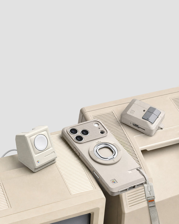 Spigen iPhone case, AirPods case, and charging accessory in retro beige, arranged on top of a vintage Macintosh computer for a matching aesthetic