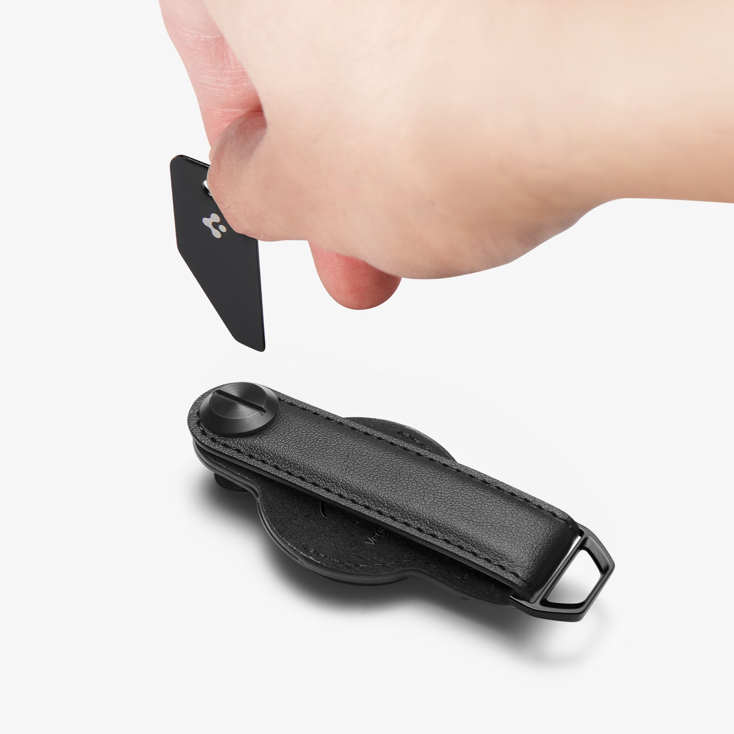 AHP09660 - Apple AirTag Valentinus Pro in Black showing a removal tool used to open the lock screw