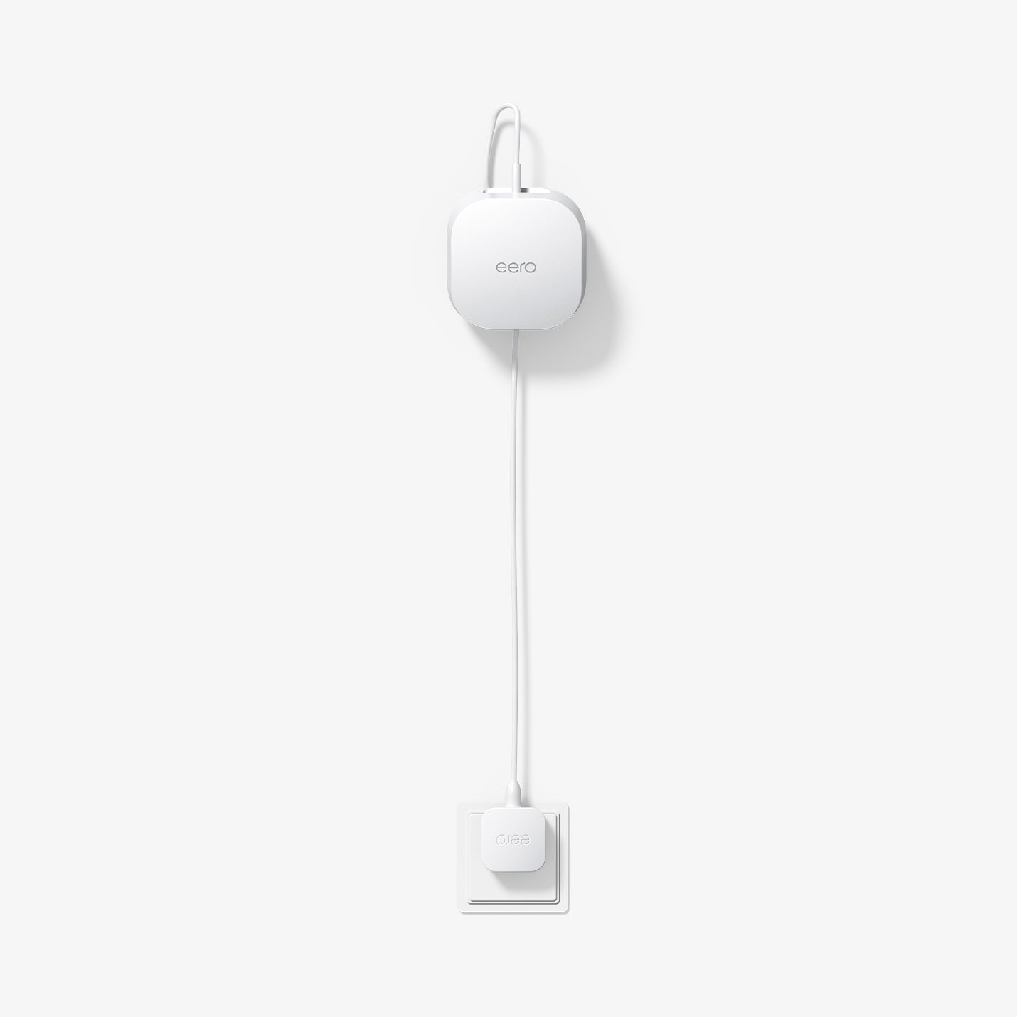 AMP09409 - Eero 6 Mount | ER110 in White showing the front and partial top installed and plugged in