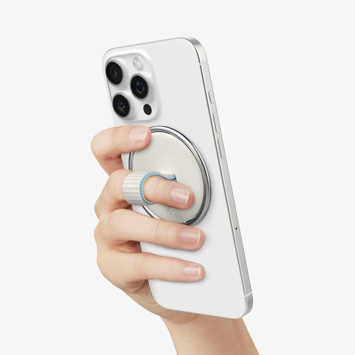 AMP09176 - O-Mag Magnetic Phone Holder (MagFit) OM104 in Dune Beige showing a person's hand holding the device confidently and conveniently with o-mag ring installed