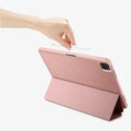 ACS07011 - iPad Pro 12.9-inch Case Urban Fit in Rose Gold showing the back, with a folded front cover propped up as a stand while a hand holding a stylus pen