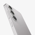 AGL07613 - Galaxy S24 Plus Optik Pro EZ Fit Lens Protector in Marble Gray showing the partial side of the camera lens protector, partial side and partial back of the device, half bodied, zoomed in