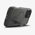 ACS08509 - iPhone 16 Pro Case Tough Armor AI (MagFit) in Frost Black showing the back, partial side and bottom with built-in kickstand propped up