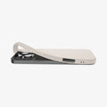 ACS08120 - iPhone 16 Pro Case Liquid Air in Natural Titanium showing the back, partially peeled off from the device on a flat