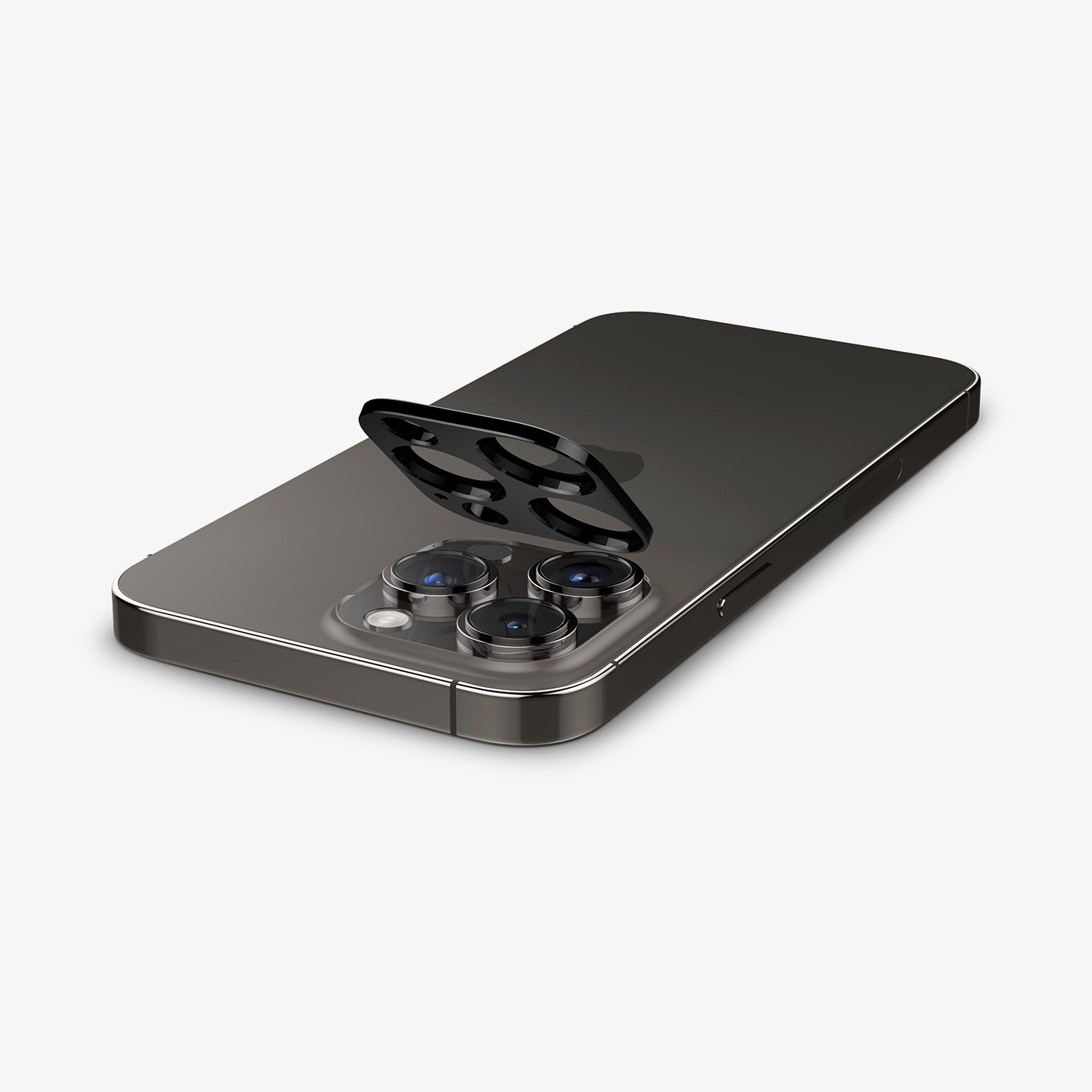 AGL06913 - iPhone 14 Pro / 14 Pro Max Optik Lens Protector in black showing the optik lens protector being installed onto camera lens