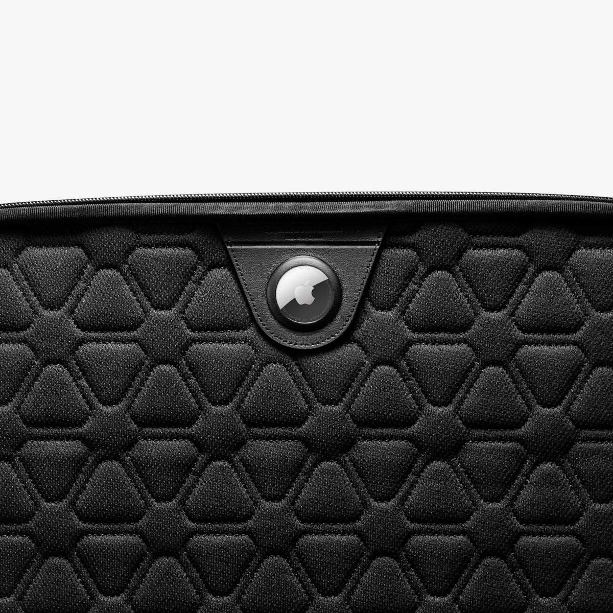 AFA04270 - Rugged Armor Pro Laptop Pouch 14" in Black showing the partial front, with AirTag attached