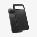 ACS07697 - Pixel 9 Pro Case Thin Fit in Black showing the back, partially hovering in front of the device