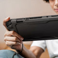ACS09075 - Nintendo Switch 2 Rugged Armor in Matte Black showing a person comfortably holding the device showing its back