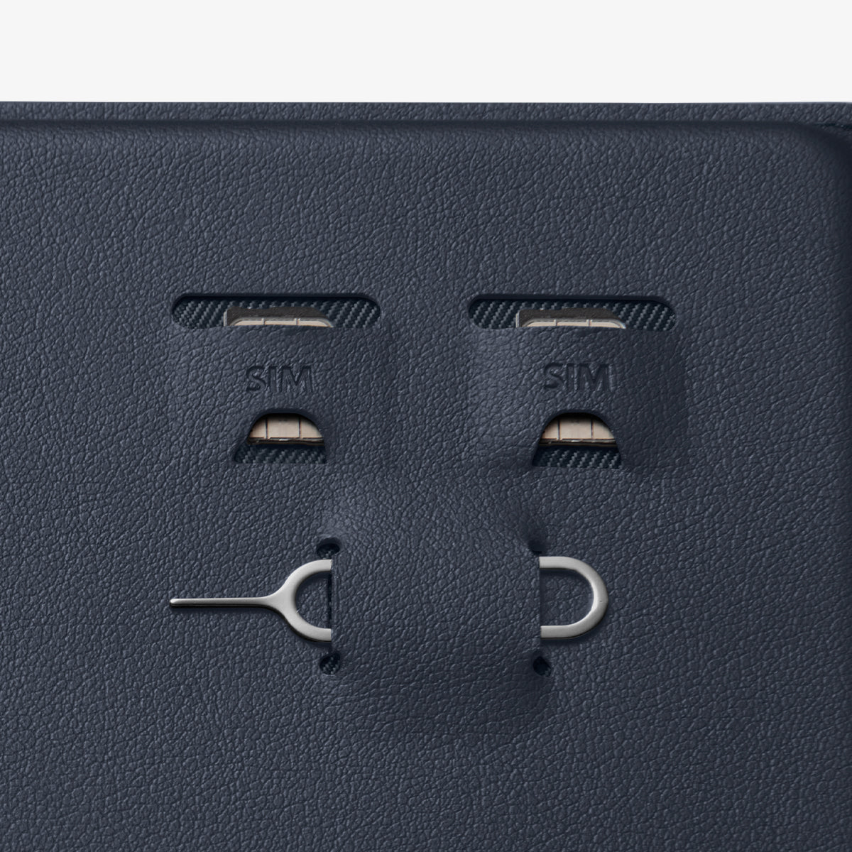 AFA08721 - Passport Holder in Navy Blue showing the sim slots for sim cards and a pin ejector
