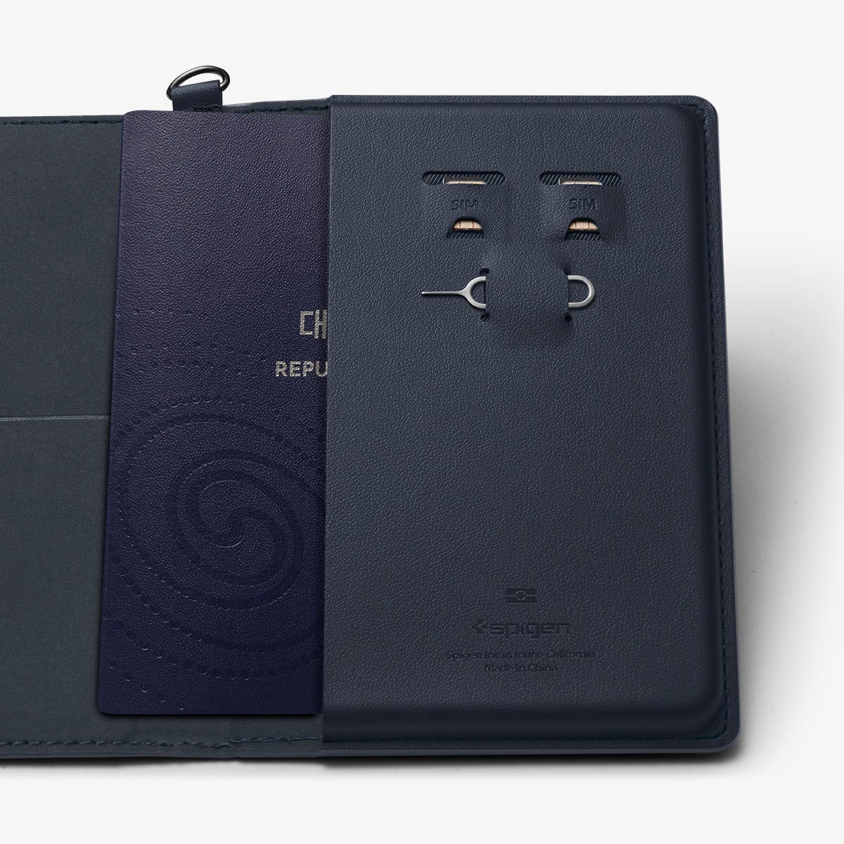 AFA08721 - Passport Holder in Navy Blue showing the inner slot of passport, sim slots for sim cards and a pin ejector