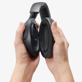ASD09691 - Spigen Active Noise Cancelling SA2403 in Black showing a person detaching the ear cup to from headphone