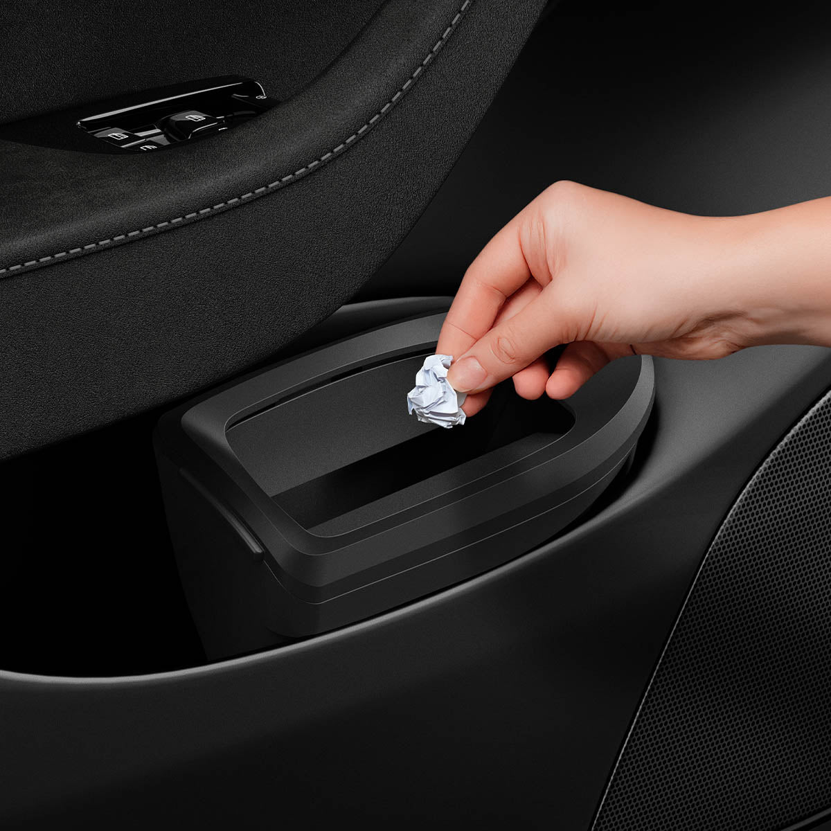 ACP09183 – Tesla Model Y Car Trash Bin in black showing trashes put to the trash can.