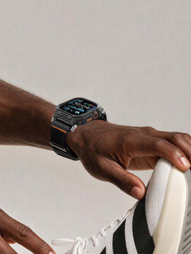 man stretching while wearing Apple Watch
