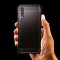611CS26199 - Galaxy A50 Case Rugged Armor in Matte Black showing the back, with a persons hand holding the device