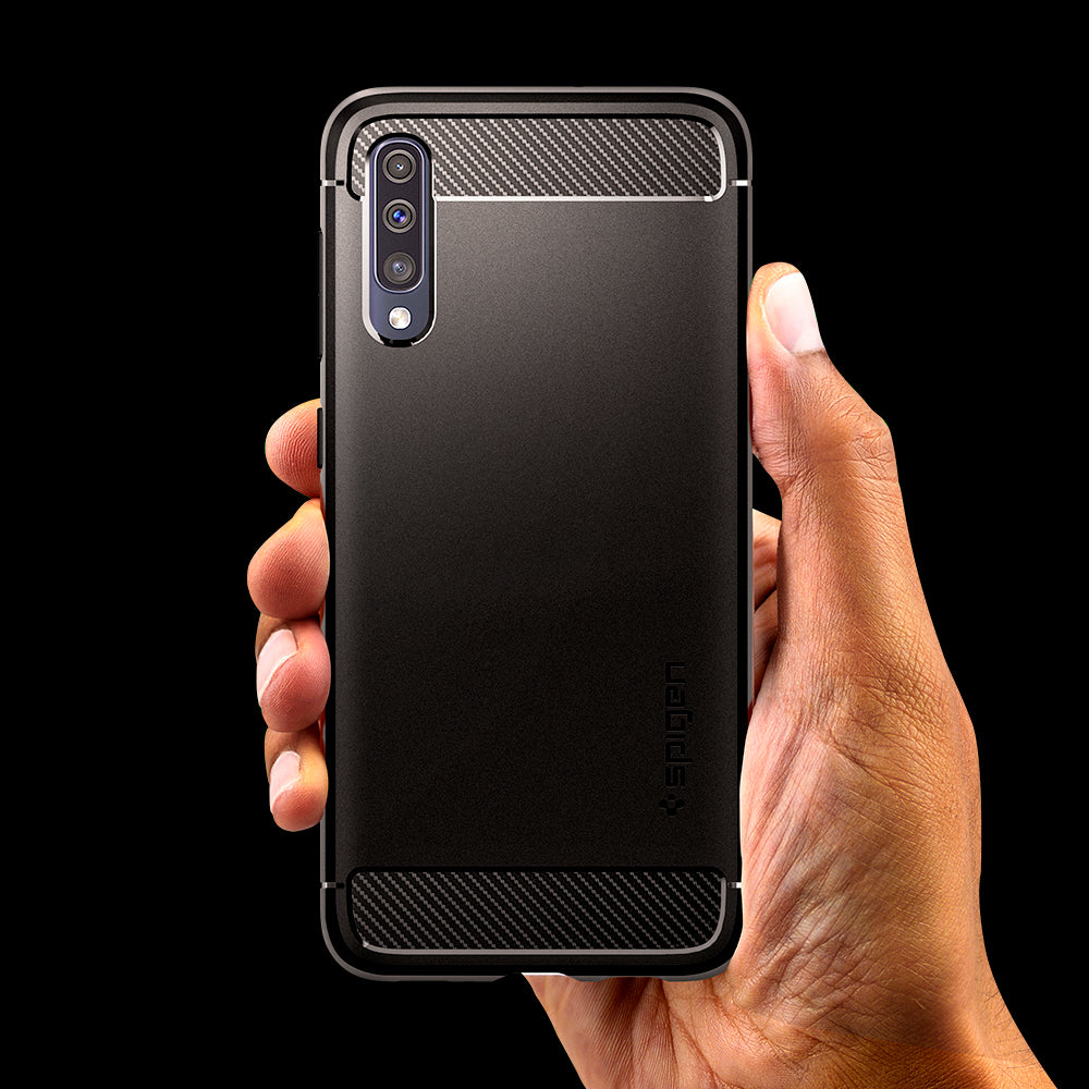 611CS26199 - Galaxy A50 Case Rugged Armor in Matte Black showing the back, with a persons hand holding the device