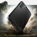 ACS05672 - Galaxy S23 Plus Case Tough Armor in black showing back in front of the rock.