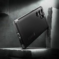 ACS05623 - Galaxy S23 Ultra Case Tough Armor in black showing back in front of the rock.