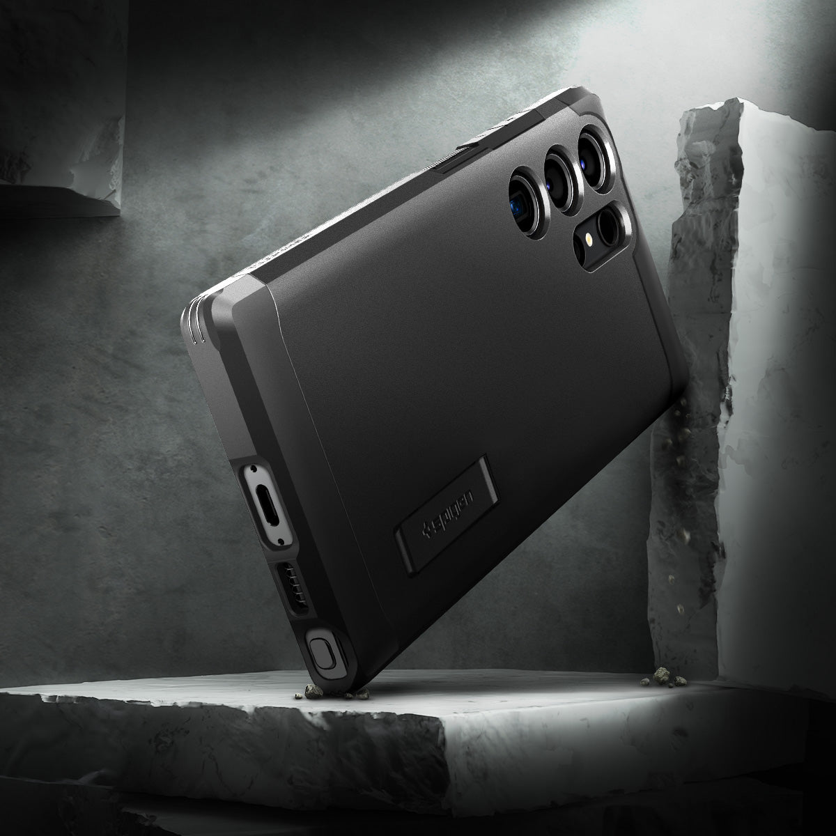 ACS05623 - Galaxy S23 Ultra Case Tough Armor in black showing back in front of the rock.