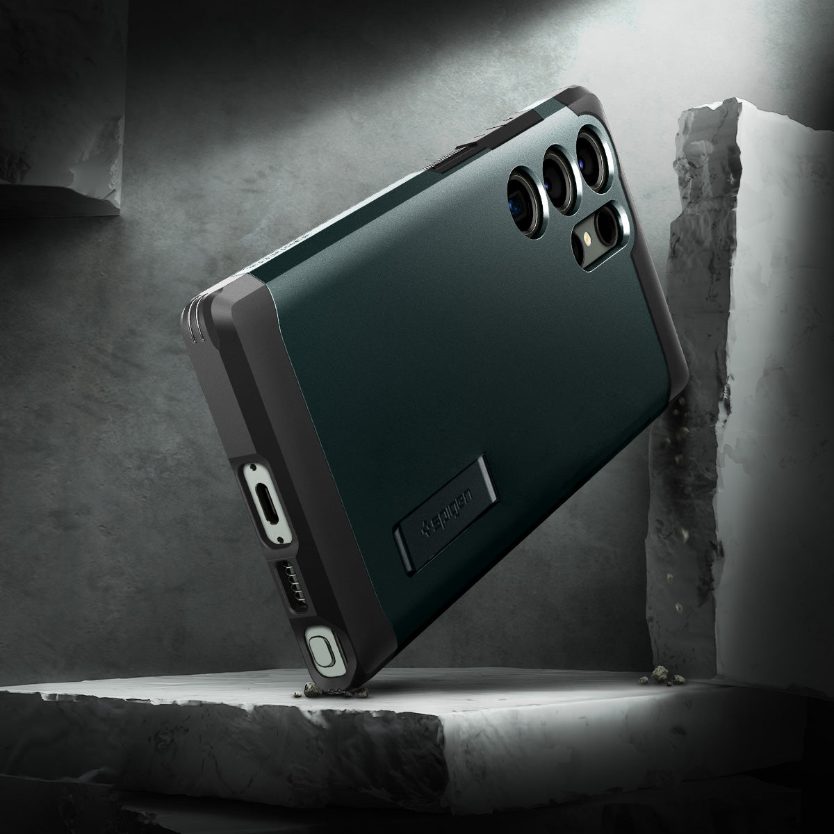 ACS05625 - Galaxy S23 Ultra Case Tough Armor in abyss green showing back in front of the rock.