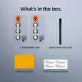 AGL07613 - Galaxy S24 Plus Optik Pro EZ Fit Lens Protector in Marble Gray showing what's in the box. 2 Alignment trays, Glass removal tool, Cleaning cloth and Dust removal sticker