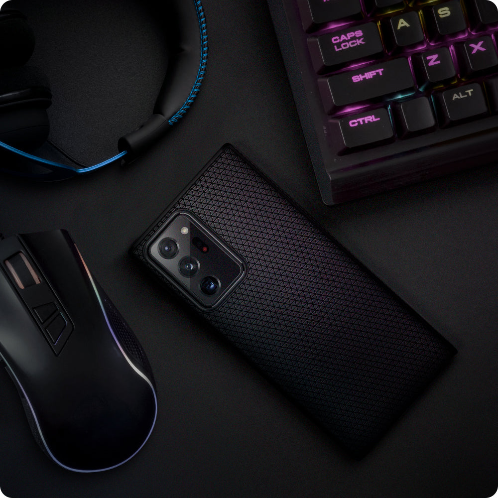 ACS01392 - Galaxy Note 20 Ultra Liquid Air Case in matte black showing the back with other things around