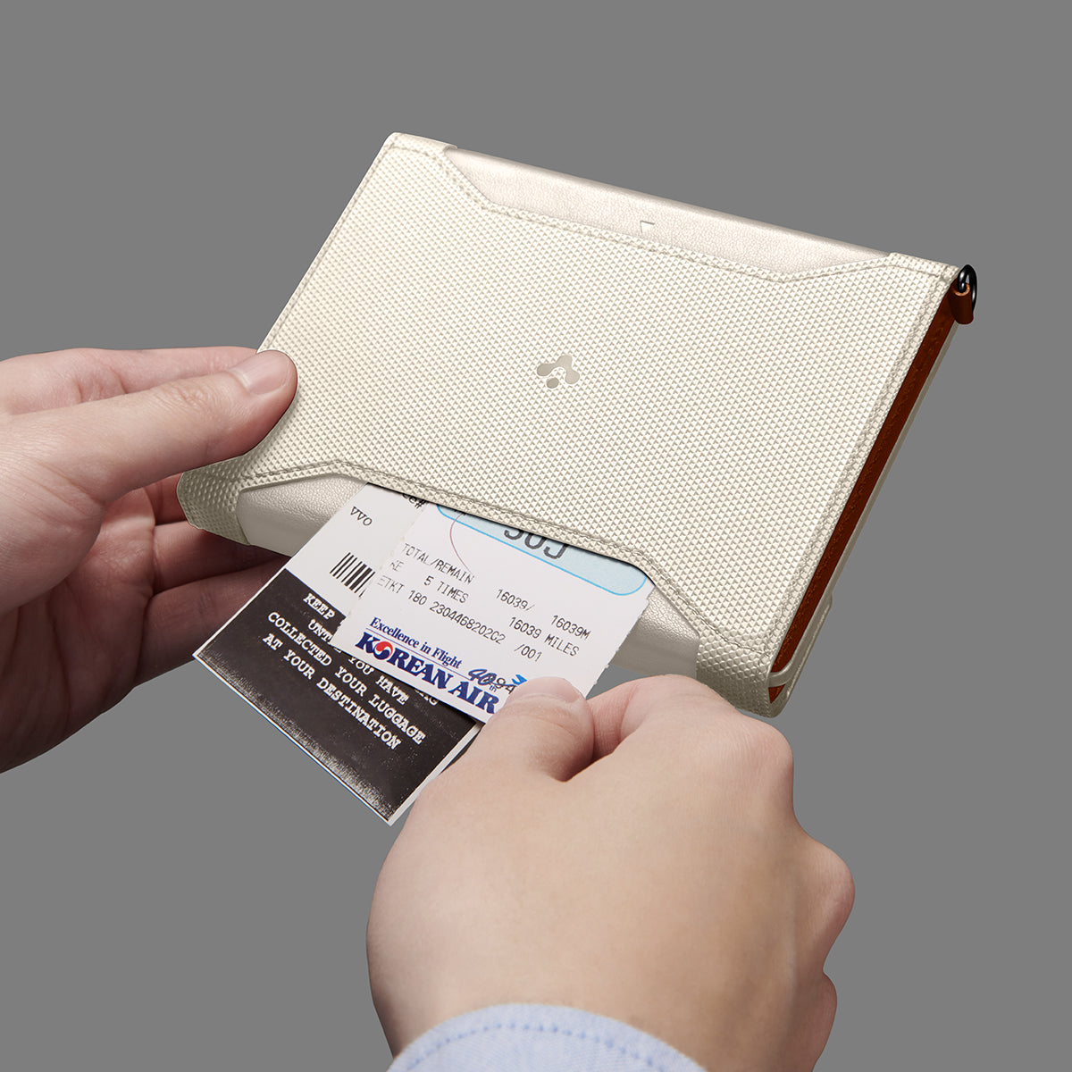 AFA08348 - Passport Holder in dune beige showing the front with outer secret pocket for extra storage