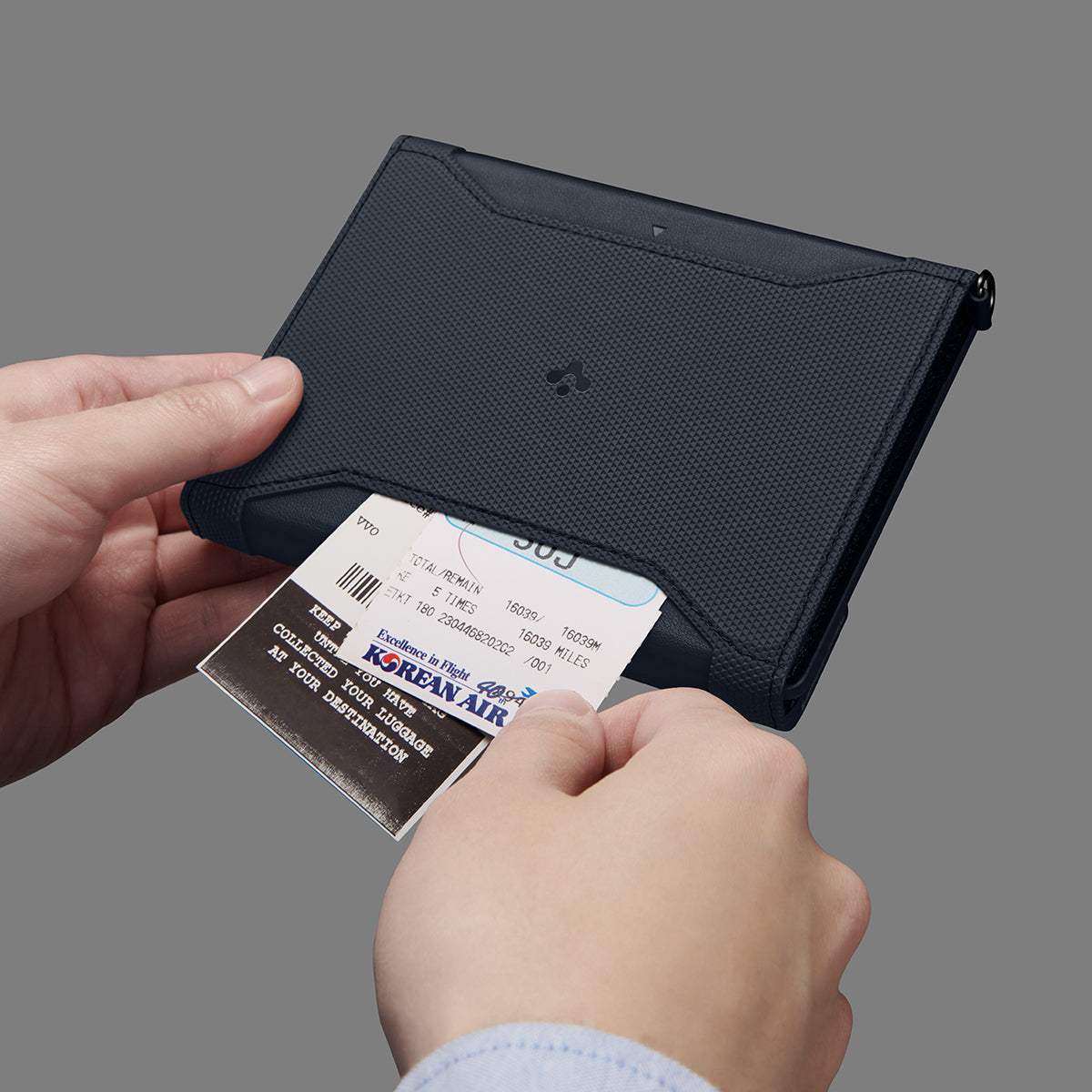 AFA08721 - Passport Holder in Navy Blue showing the front with outer secret pocket for extra storage