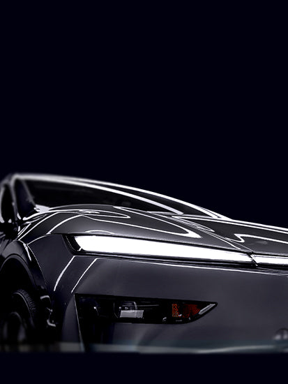 Showing the front corner of Tesla Model Y Juniper a dark grey color