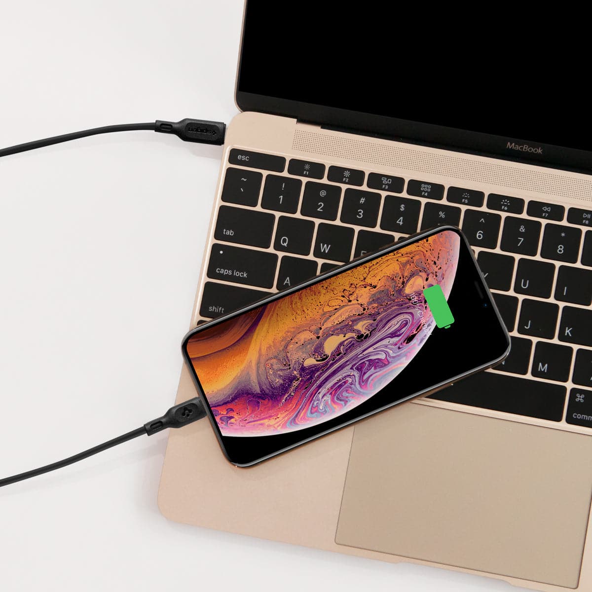 000CA27021 - DuraSync USB-C to Lightning Cable in black showing the charger connected to laptop charging a phone