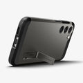 ACS05719 - Galaxy S23 Case Tough Armor in gunmetal showing the back and bottom with device propped up by built in kickstand