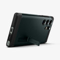 ACS05625 - Galaxy S23 Ultra Case Tough Armor in abyss green showing the back and bottom with device propped up by built in kickstand