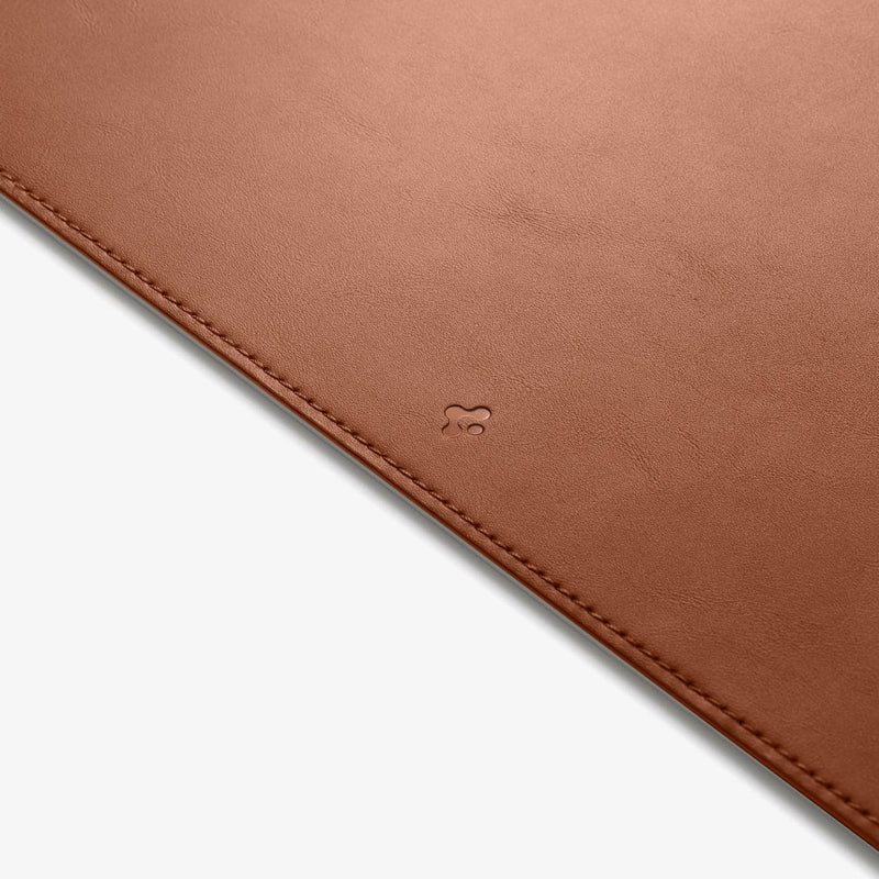 APP04763 - LD302 Desk Pad in brown showing the front zoomed in on the Spigen logo