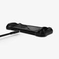 ACS04020 - Nintendo Switch OLED Case Rugged Armor in matte black showing the back and bottom with charging cable hovering next to port