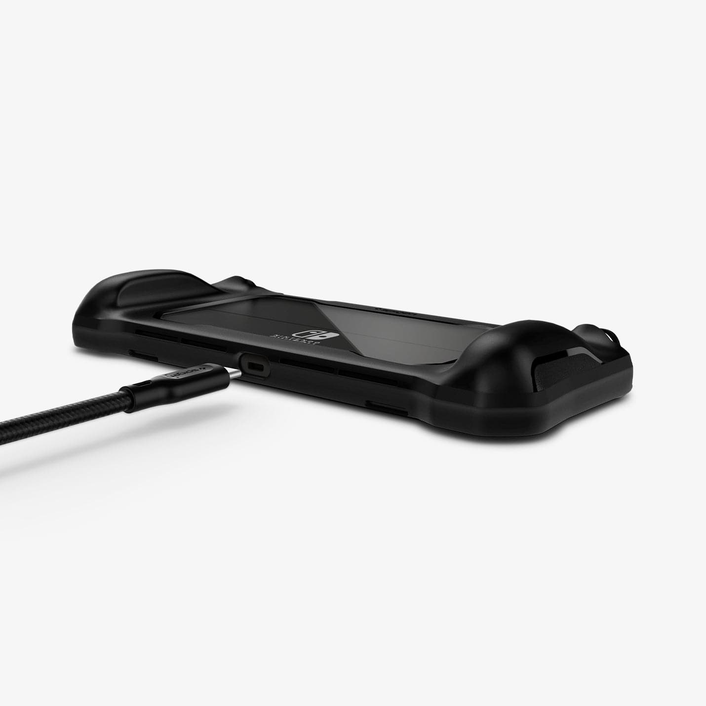 ACS04020 - Nintendo Switch OLED Case Rugged Armor in matte black showing the back and bottom with charging cable hovering next to port