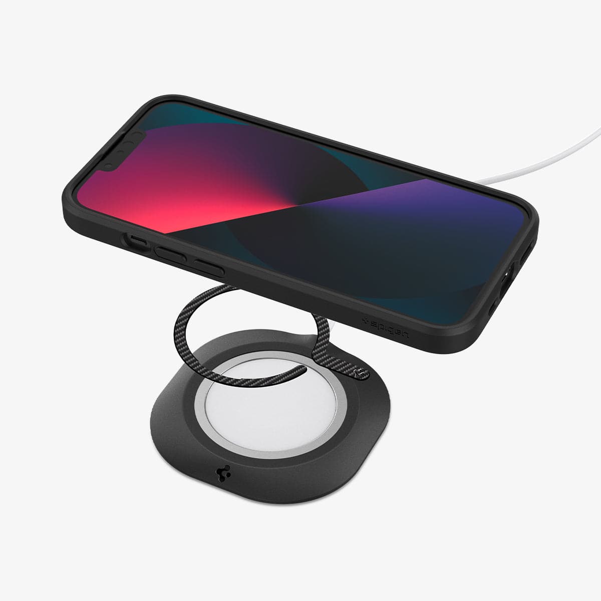 ACP03804 - OneTap MagSafe Metal Plate (MagFit) in carbon showing the device and metal plate hovering above a magsafe charger