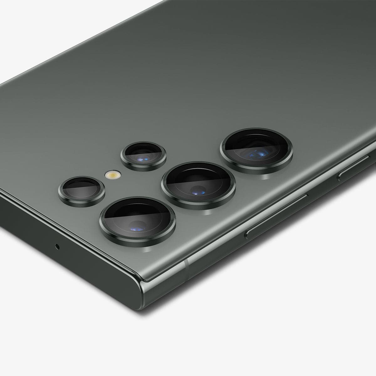 AGL06166 - Galaxy S23 Ultra EZ Fit Optik Pro Lens Protector in green showing the device laying flat and zoomed in on camera lens