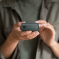 ACS06084 - Galaxy S23 Case Thin Fit in abyss green showing the device in someone's hand