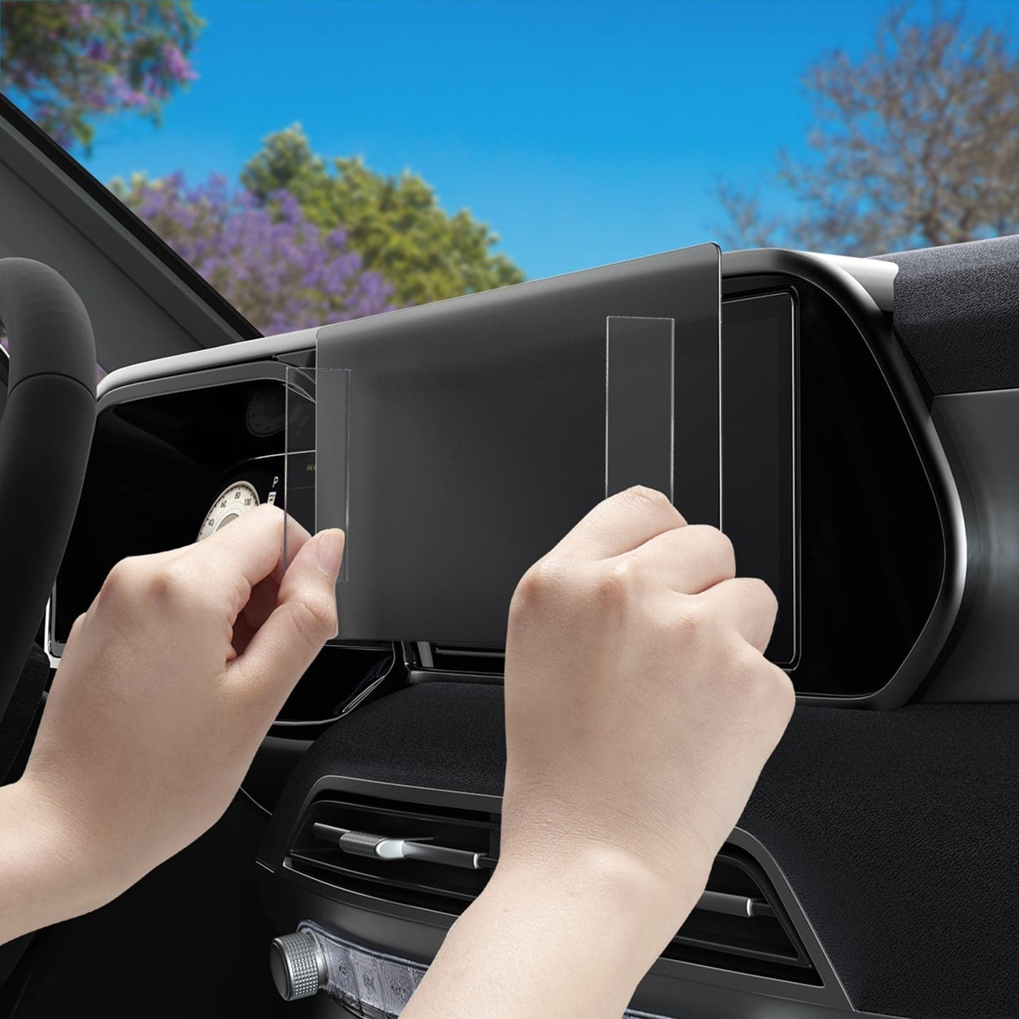 AGL06867 - Hyundai Palisade 12.3" Screen Protector GLAS.tR SLIM Anti-Glare showing hands installing the screen protector onto display inside of car