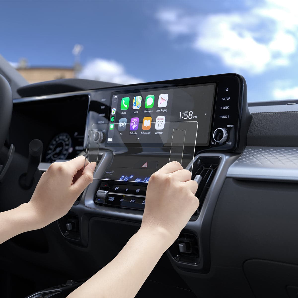 AGL04580 - Hyundai Tucson Screen Protector GLAS.tR SLIM Anti-Glare showing hands installing screen protector onto display inside of car