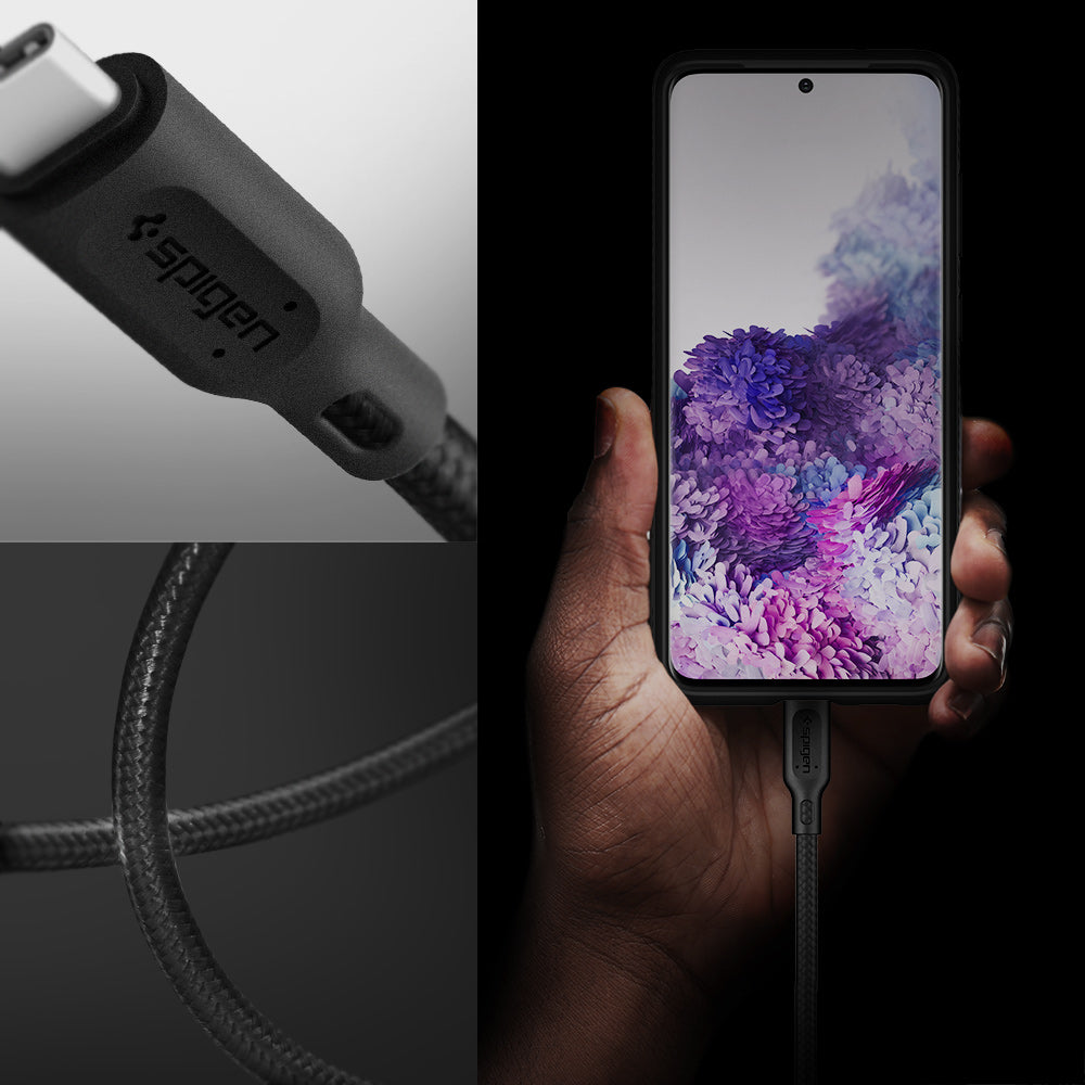 000CA25702 - DuraSync™ USB-C to USB-C 2.0 Cable C11C1 in Black showing the a hand holder a device while attached to a charger, a head of a charger and it's durable wire