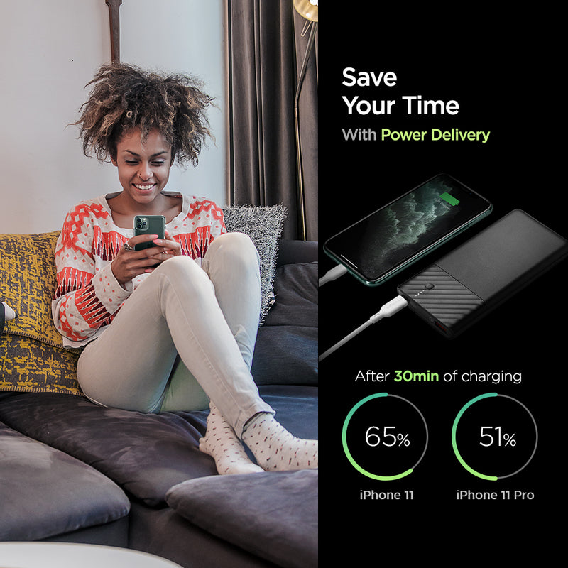 000BA26139 - PocketBoost™ 10,000mAh 18W Portable Charger F732QC in Black showing the Save Your Time With Power Delivery. After 30min of charging iPhone 11(65%) while iPhone 11 Pro(51%). A woman sitting on a sofa holding a device