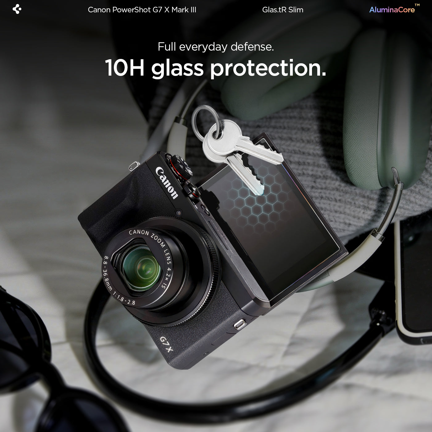 AGL11652 - PowerShot G7 X Mark III Glas.tR SLIM showing 10H glass protection feature with a lifestyle shot of Canon PowerShot G7 X Mark III and keys resting on the screen protector, demonstrating scratch resistance