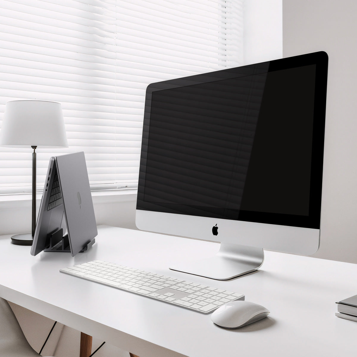 AMP10640 - Vertical Laptop Stand | LD208S4 in Space Gray showing side on the desk