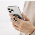 AMP09334 - O-Mag Magnetic Phone Holder (Mag Fit) | OM106 showing hand gripping clear iphone case with finger looped through extended black ring holder