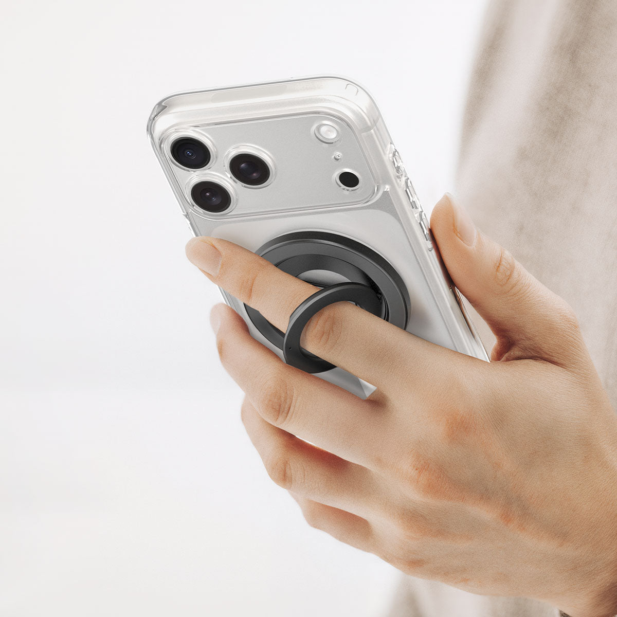 AMP11739 - O-Mag Magnetic Phone Holder (Mag Fit+) | OM108 showing a hand holding a phone with the ring holder attached and flipped open
