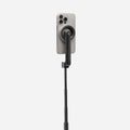 AMP07659 - Tripod Selfie Stick (Mag Fit) | S580W in Black showing the back of an iPhone attached magnetically to the S580W selfie stick via the MagFit mount, with the stick fully extended against a light gray background.