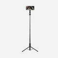 AMP07659 - Tripod Selfie Stick (Mag Fit) | S580W in Black showing the S580W selfie stick tripod fully extended as a floor-standing tripod with an iPhone mounted horizontally in landscape orientation against a light gray background.