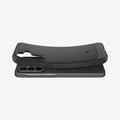 ACS09795 - Spigen Rugged Armor Galaxy A37 5G case in Matte Black lifting away from phone, showing flexible TPU construction