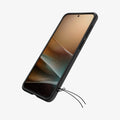 ACS09794 - Spigen Rugged Armor Galaxy A57 5G case in Matte Black showing lanyard port at bottom with cord attached
